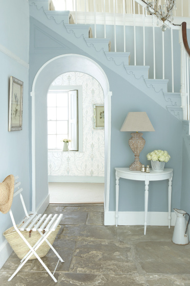 Hallway featuring walls painted in multiple shades of 'Bone China Blue' and a console table painted in 'Shirting'.