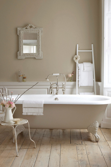 Bathroom with walls, bathtub and panelling painted in various shades of Rolling Fog, a collection of neutral brown paints.