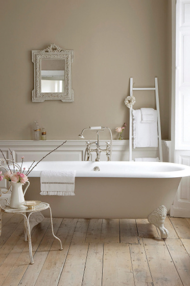 Bathroom with walls, bathtub and panelling painted in various shades of Rolling Fog, a collection of neutral brown paints.
