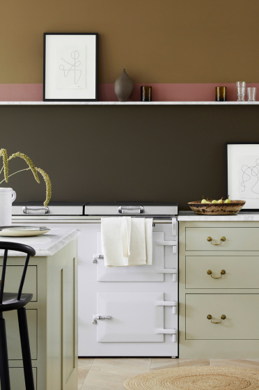 Kitchen scheme with neutral cabinets, dark brown (Elysian Ground) and warm brown (Light Bronze Green) walls with pink stripe.