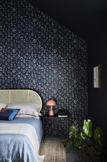 Bedroom with blue small floral wallpaper 'Millefleur - Knight' and deep blue 'Basalt' walls.
