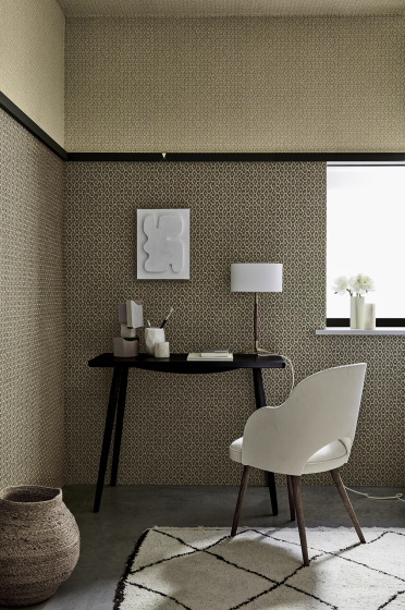 Indoor study with two shades of small scale wallpaper 'Moy' (Lime and Pompei) with a black desk and white chair.
