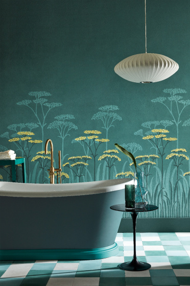 Bathroom with dark green (Harley Green) bath in front green floral mural wallpaper and yellow accents (Achillea - Aurora).