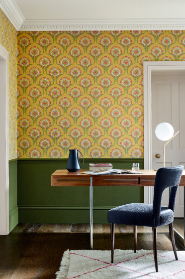 Home study space with the lower wall painted in deep green and yellow floral wallpaper (Hencroft - Punch) on the upper wall.